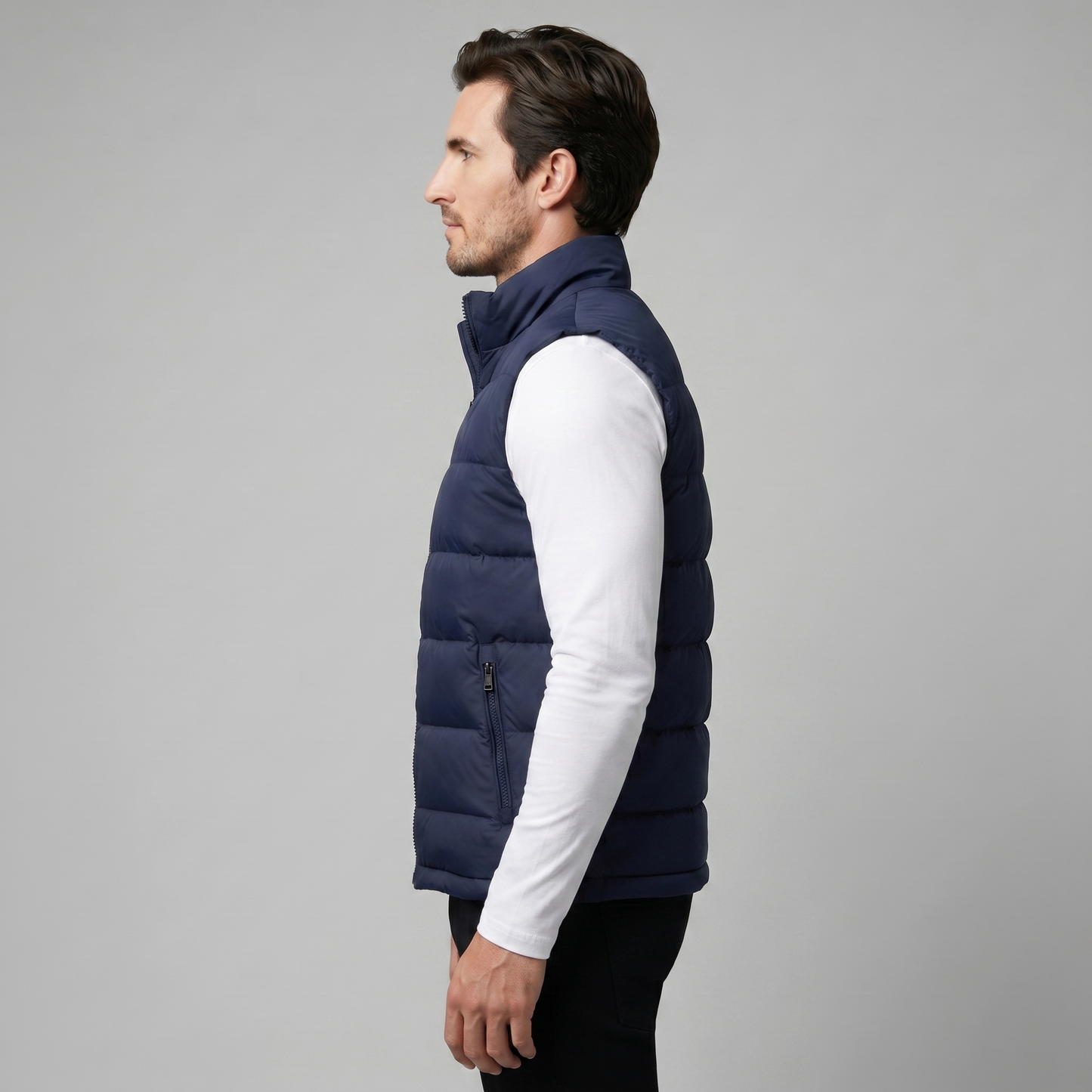Man wearing a men's quilted puffer vest with a stand collar and full zip front