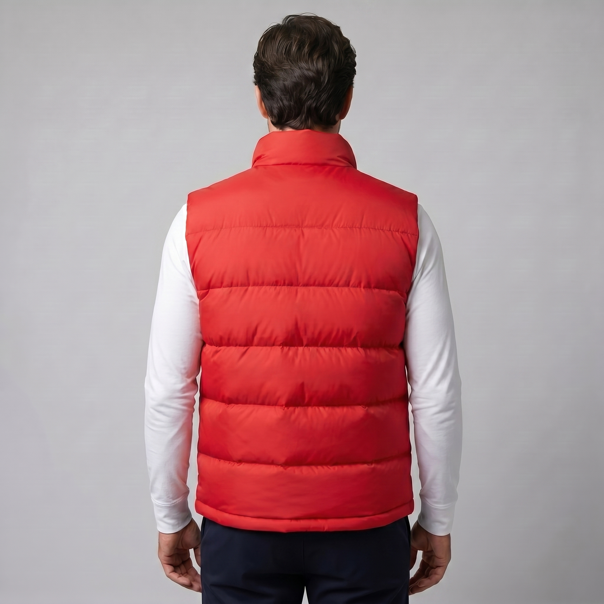Man wearing a men's quilted puffer vest with a stand collar and full zip front