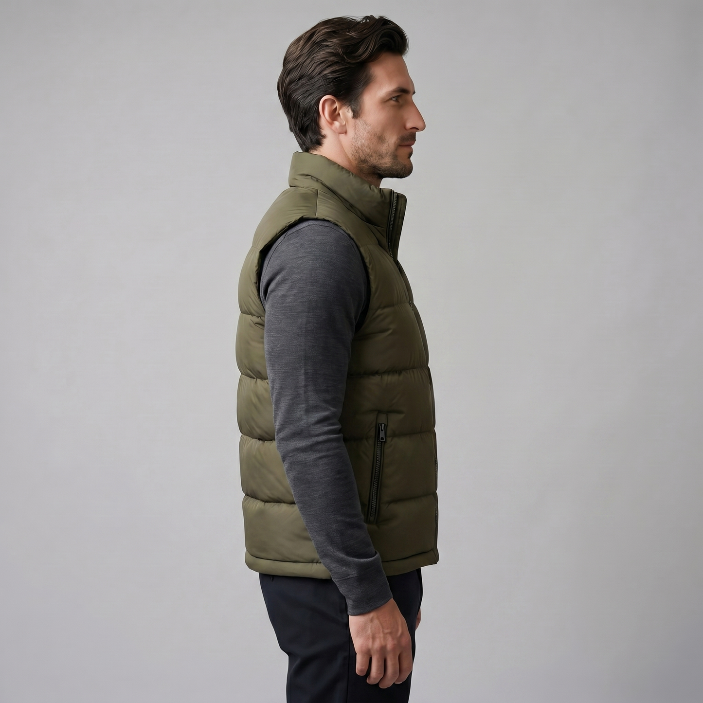 Man wearing a men's quilted puffer vest with a stand collar and full zip front