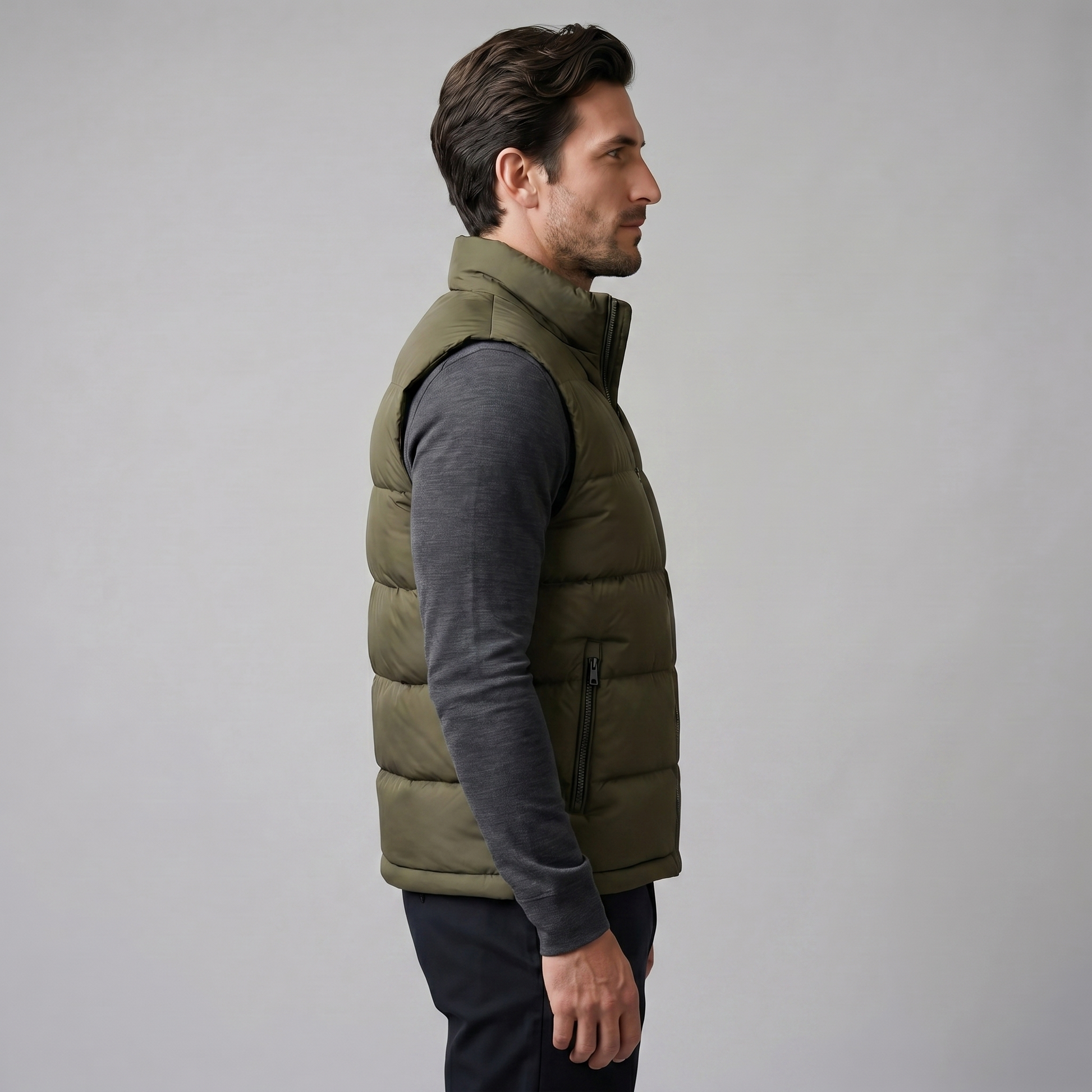 Man wearing a men's quilted puffer vest with a stand collar and full zip front