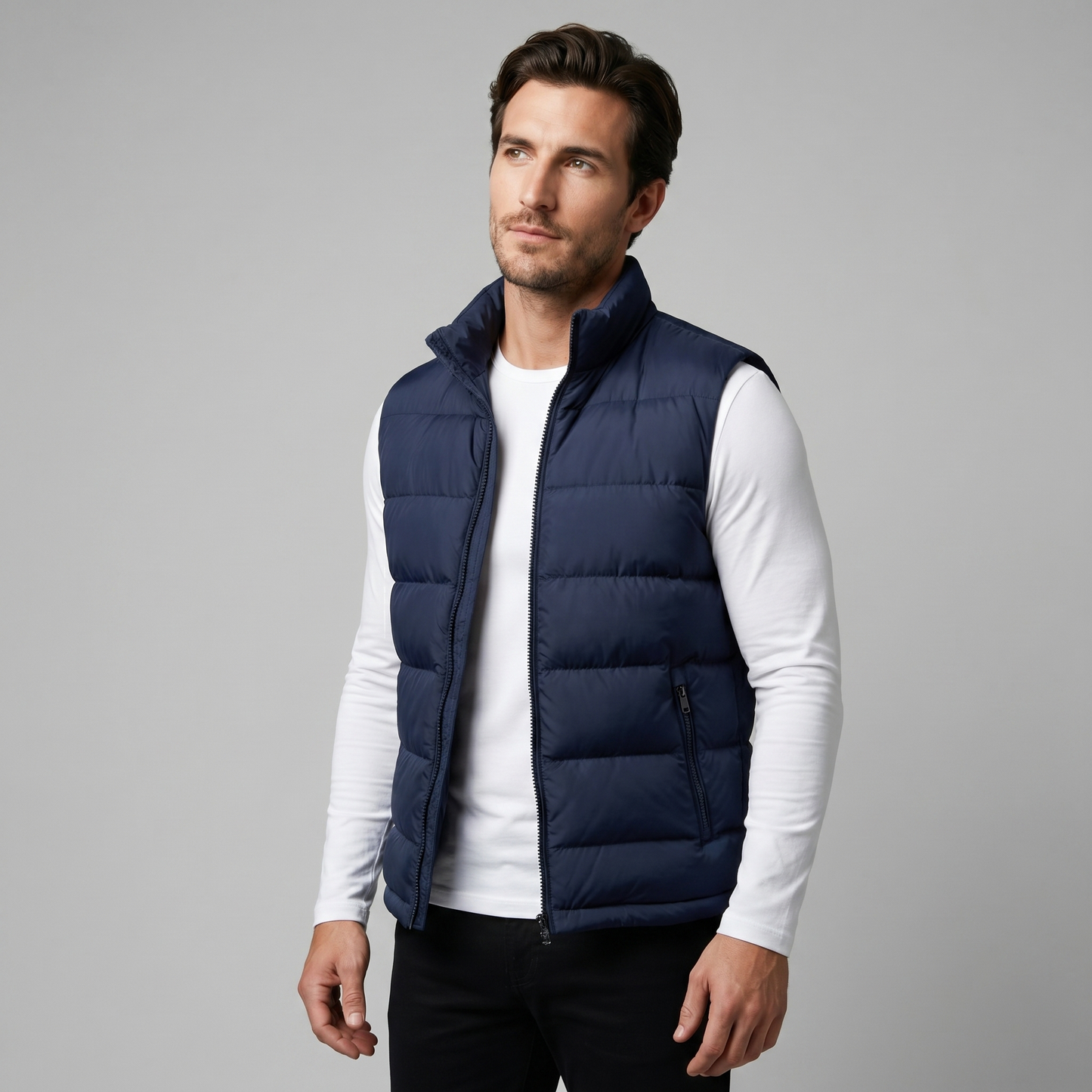 Man wearing a men's quilted puffer vest with a stand collar and full zip front