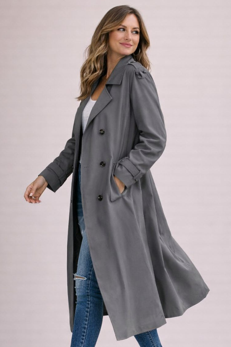 Women's double breasted belted longline trench coat with notched lapels