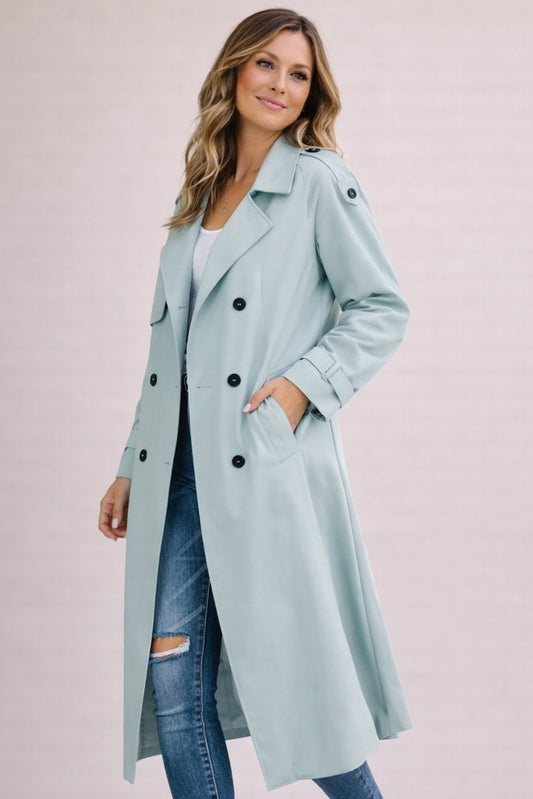 Women's double breasted belted longline trench coat with notched lapels