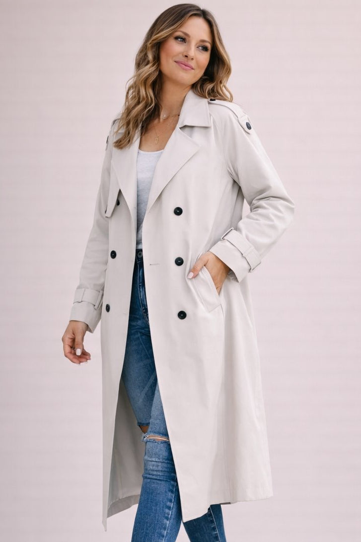 Women's double breasted belted longline trench coat with notched lapels