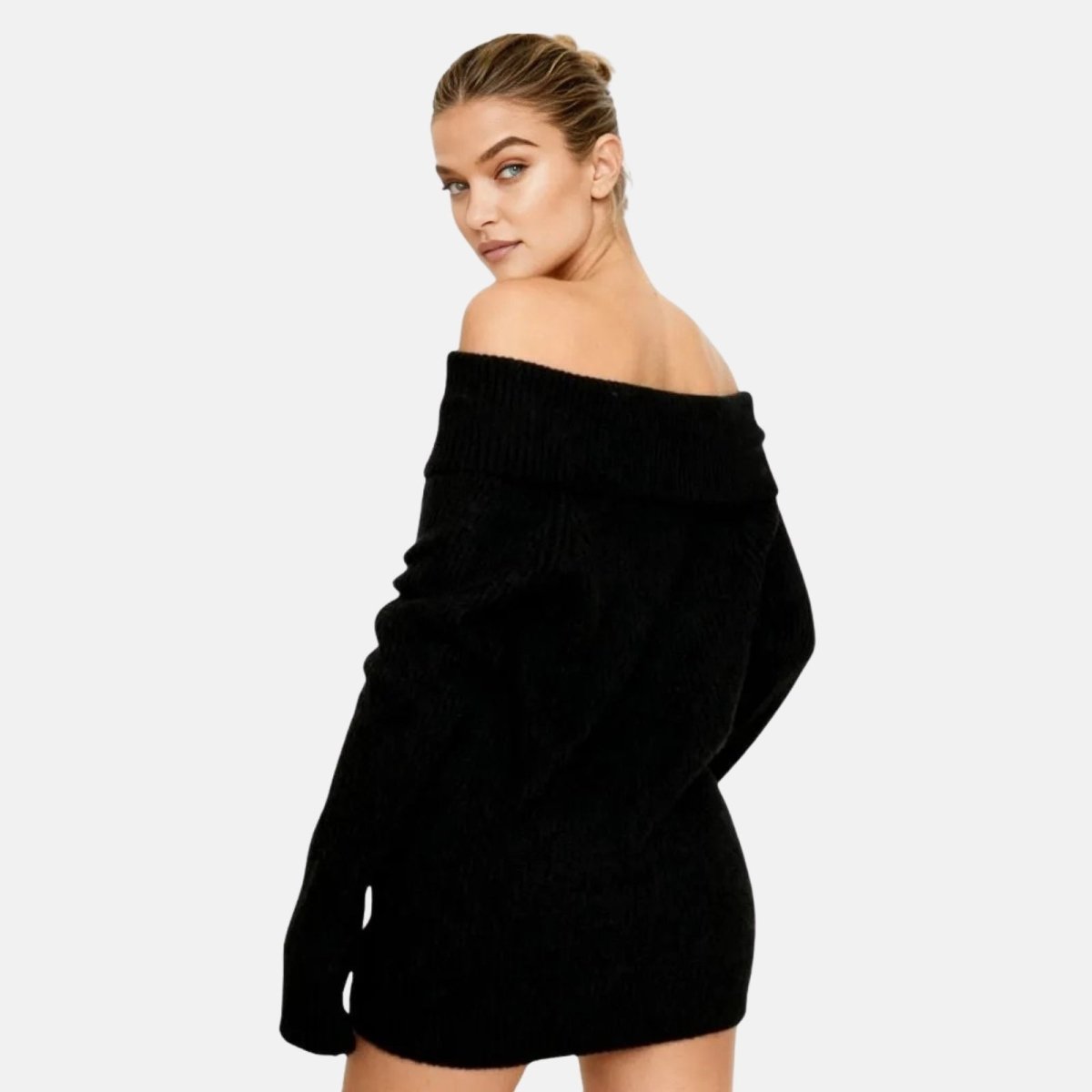 Woman wearing a black off shoulder oversized ribbed knit sweater