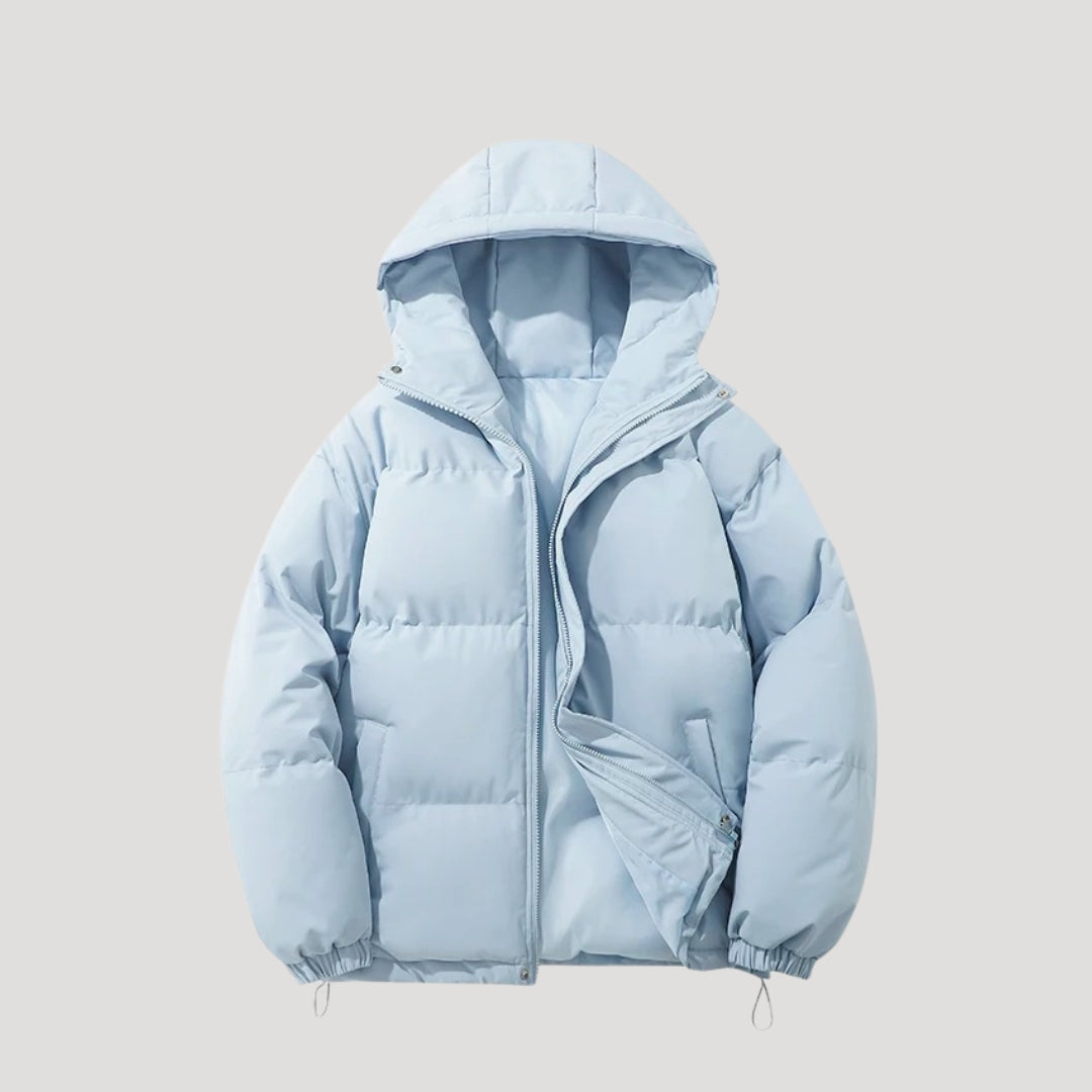 Woman wearing an insulated hooded quilted puffer coat