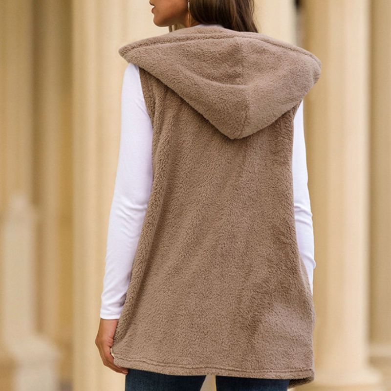 Woman wearing a hooded fleece vest with pockets