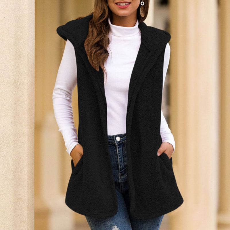 Woman wearing a hooded fleece vest with pockets