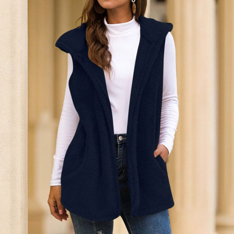 Woman wearing a hooded fleece vest with pockets
