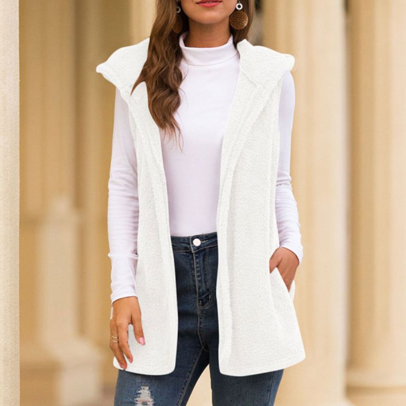Woman wearing a hooded fleece vest with pockets