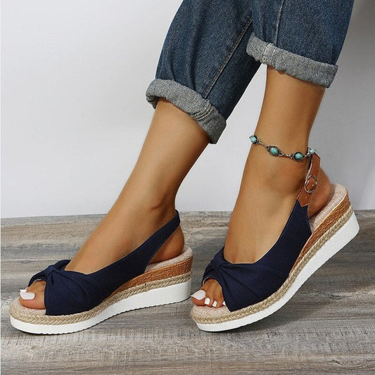 Women's peep-toe wedge slides