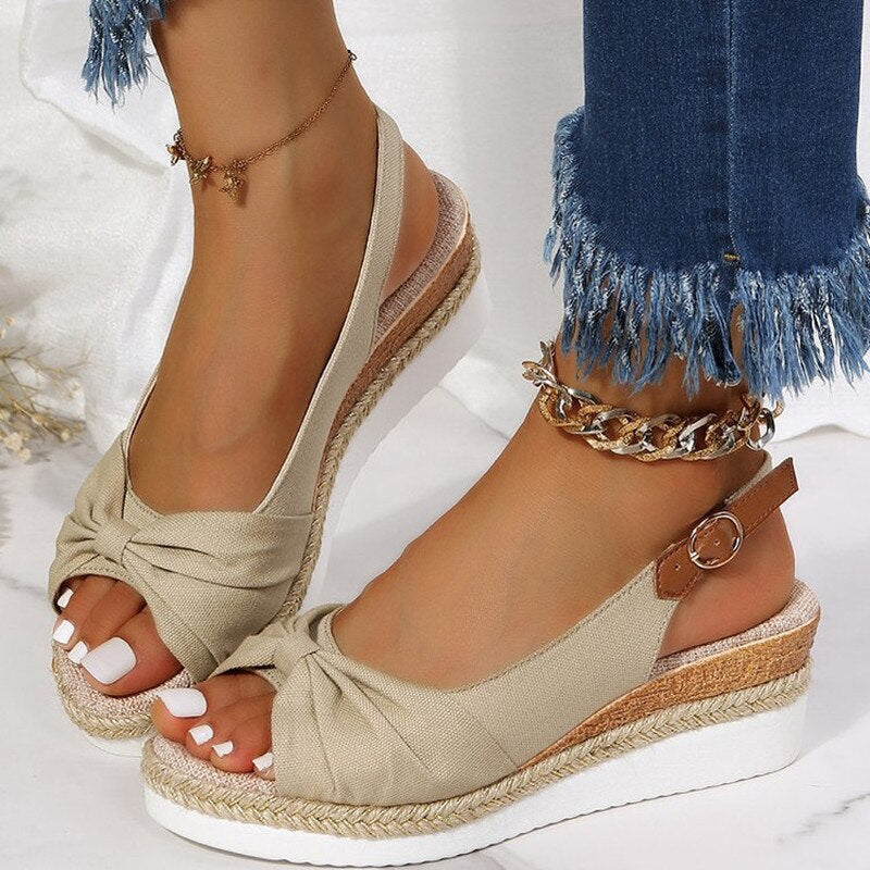 Women's peep-toe wedge slides