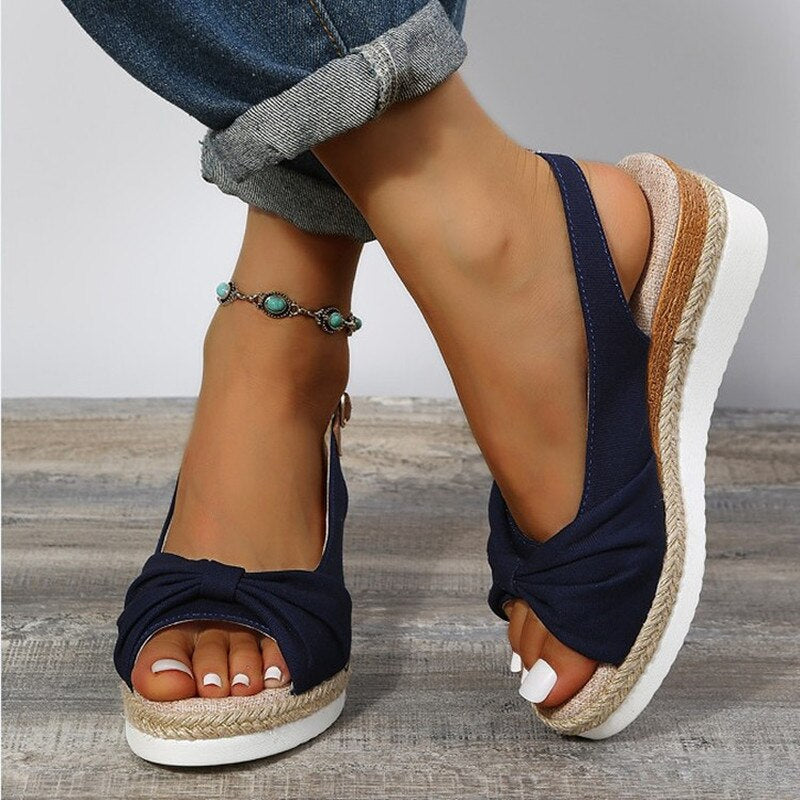 Women's peep-toe wedge slides