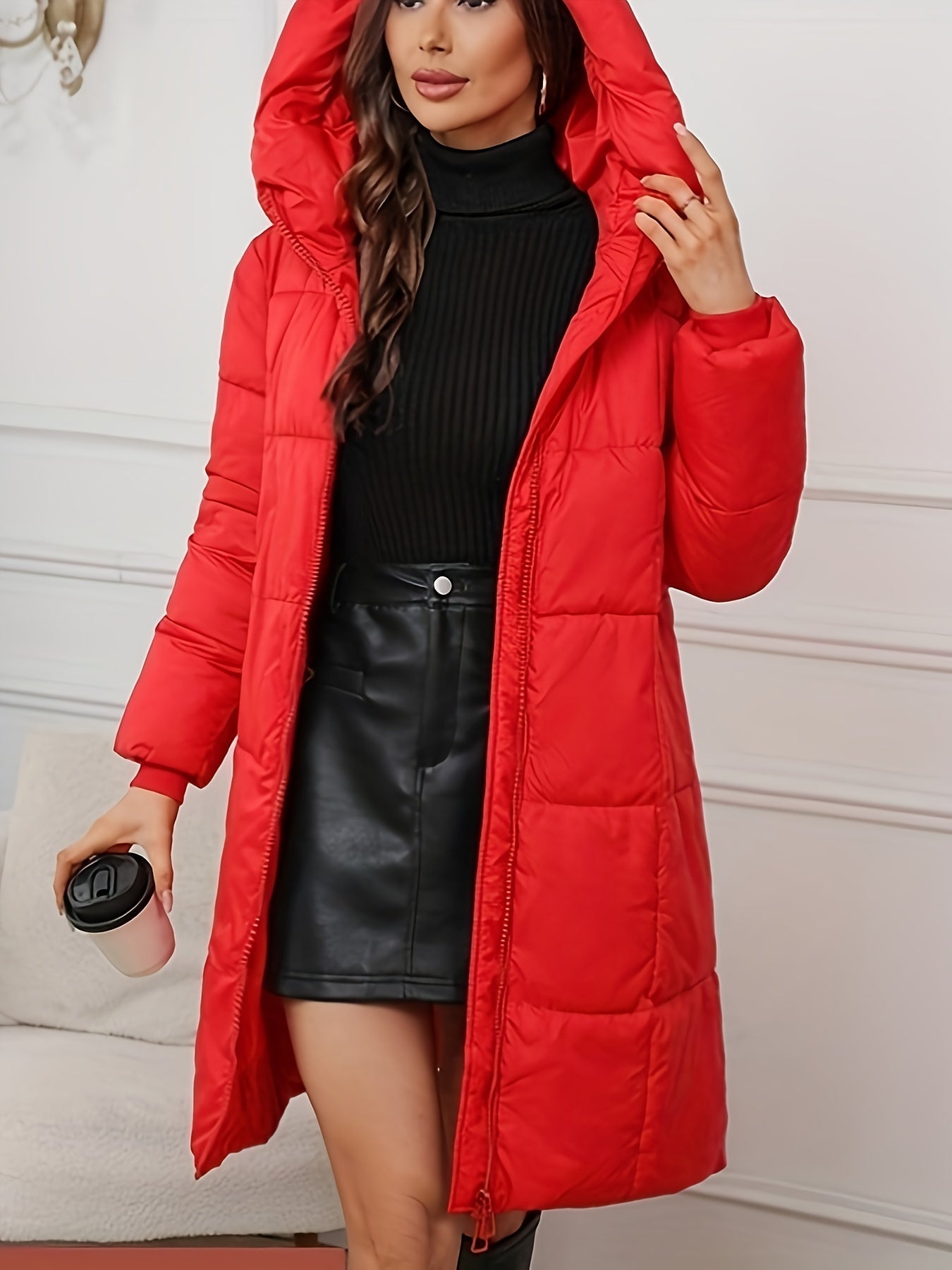 Woman wearing a mid-length hooded quilted puffer jacket
