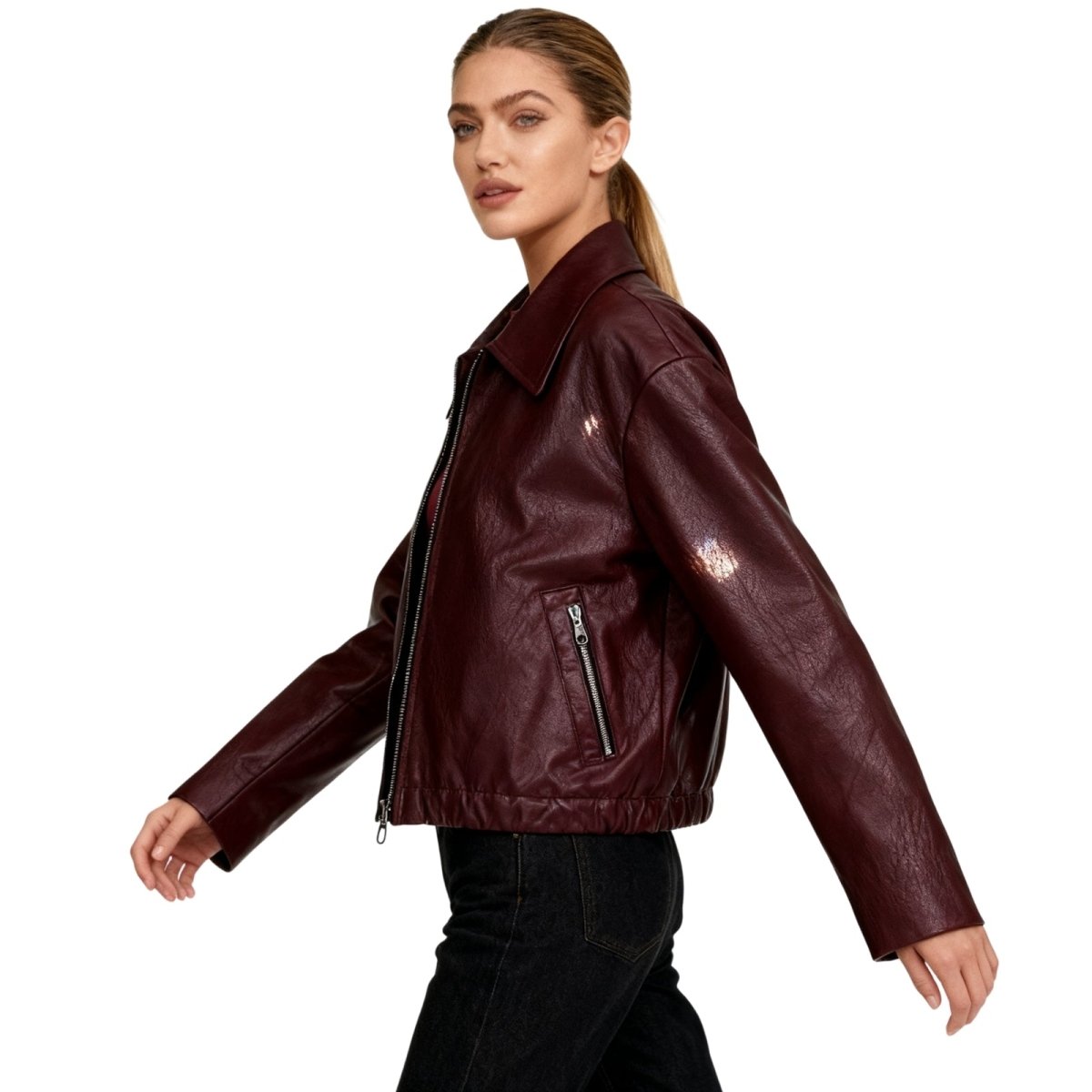 Woman wearing a cropped faux leather jacket