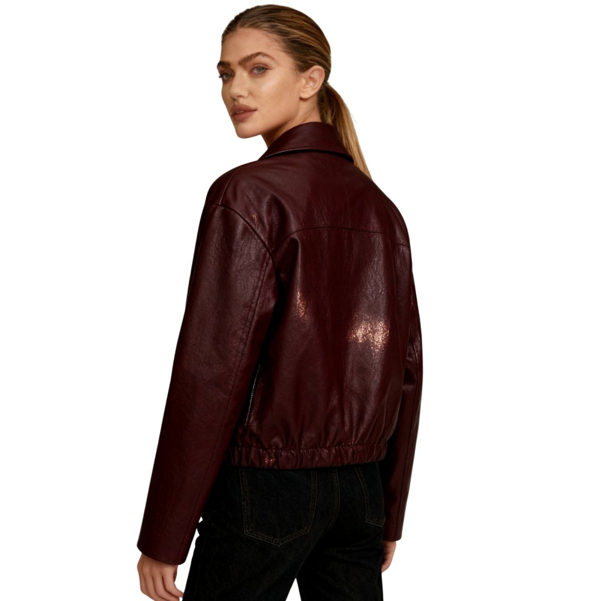 Woman wearing a cropped faux leather jacket