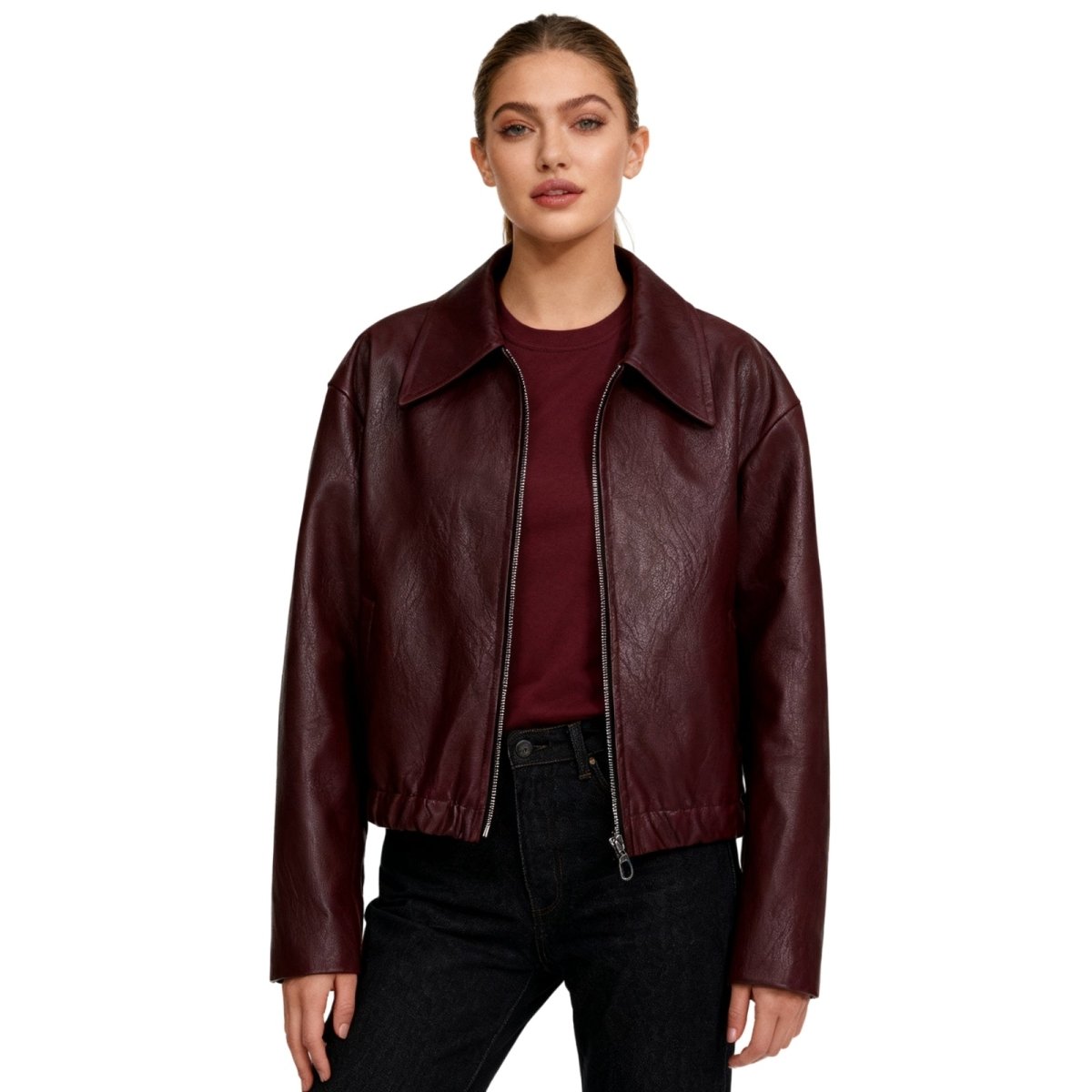 Woman wearing a cropped faux leather jacket