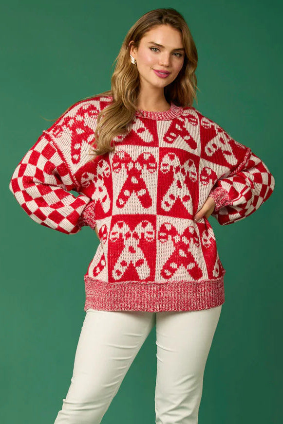 Woman wearing a gingerbread knit Christmas sweater