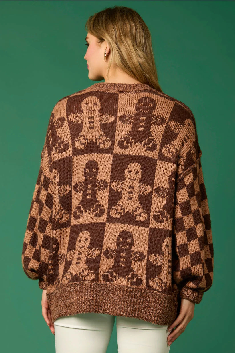 Woman wearing a gingerbread knit Christmas sweater