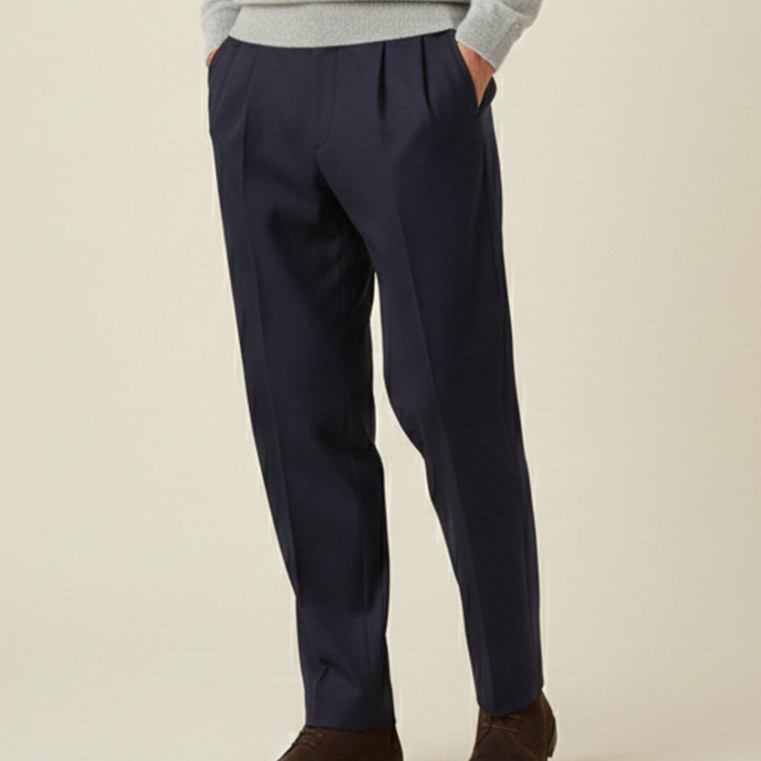 Man wearing formal pleated suit pants