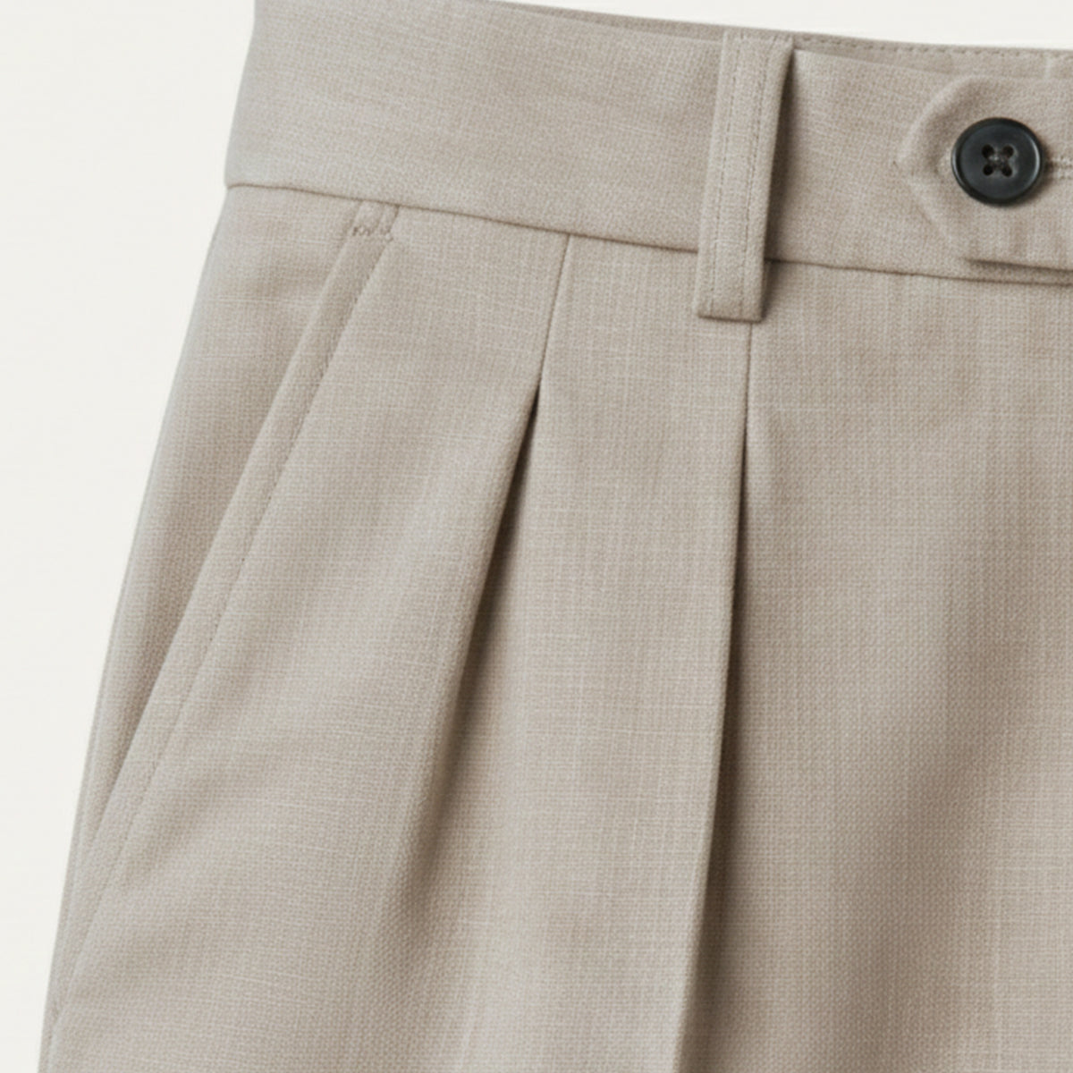 Man wearing formal pleated suit pants