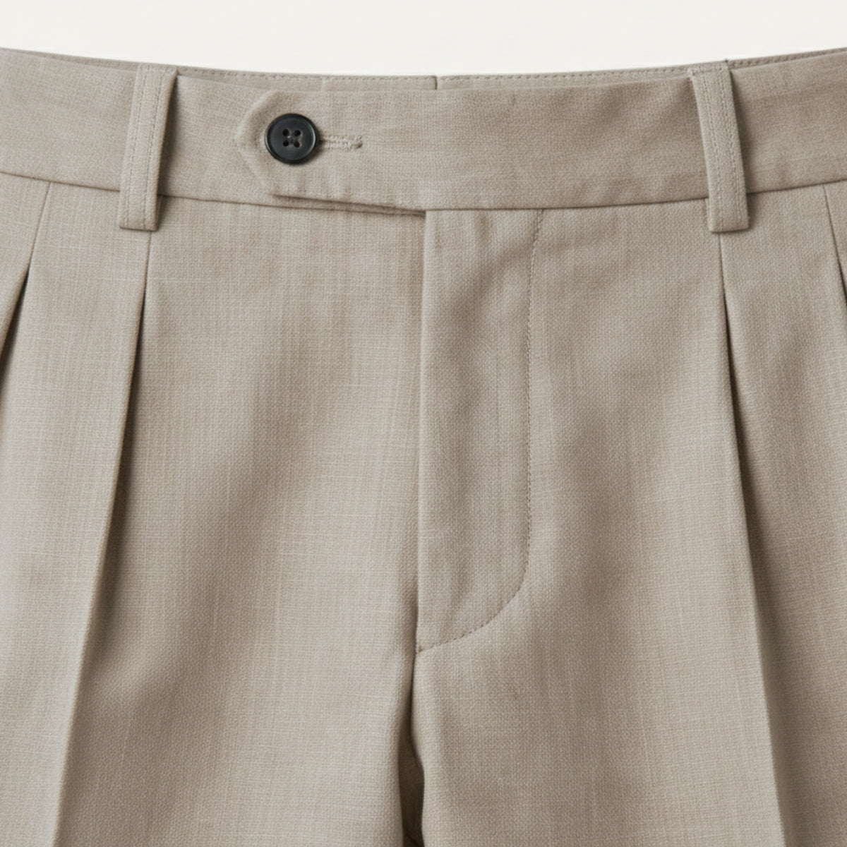 Man wearing formal pleated suit pants