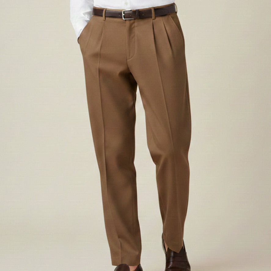 Man wearing formal pleated suit pants
