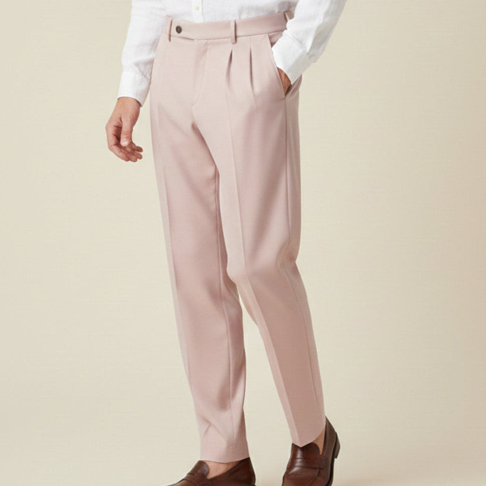 Man wearing formal pleated suit pants