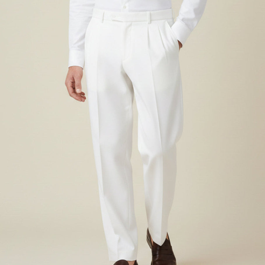 Man wearing formal pleated suit pants