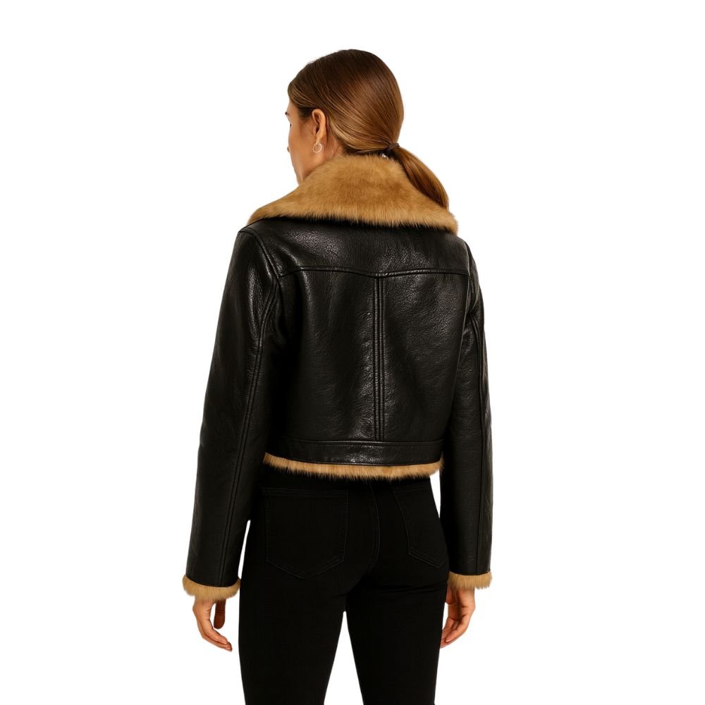 Woman wearing a cropped black faux leather aviator jacket with faux shearling collar