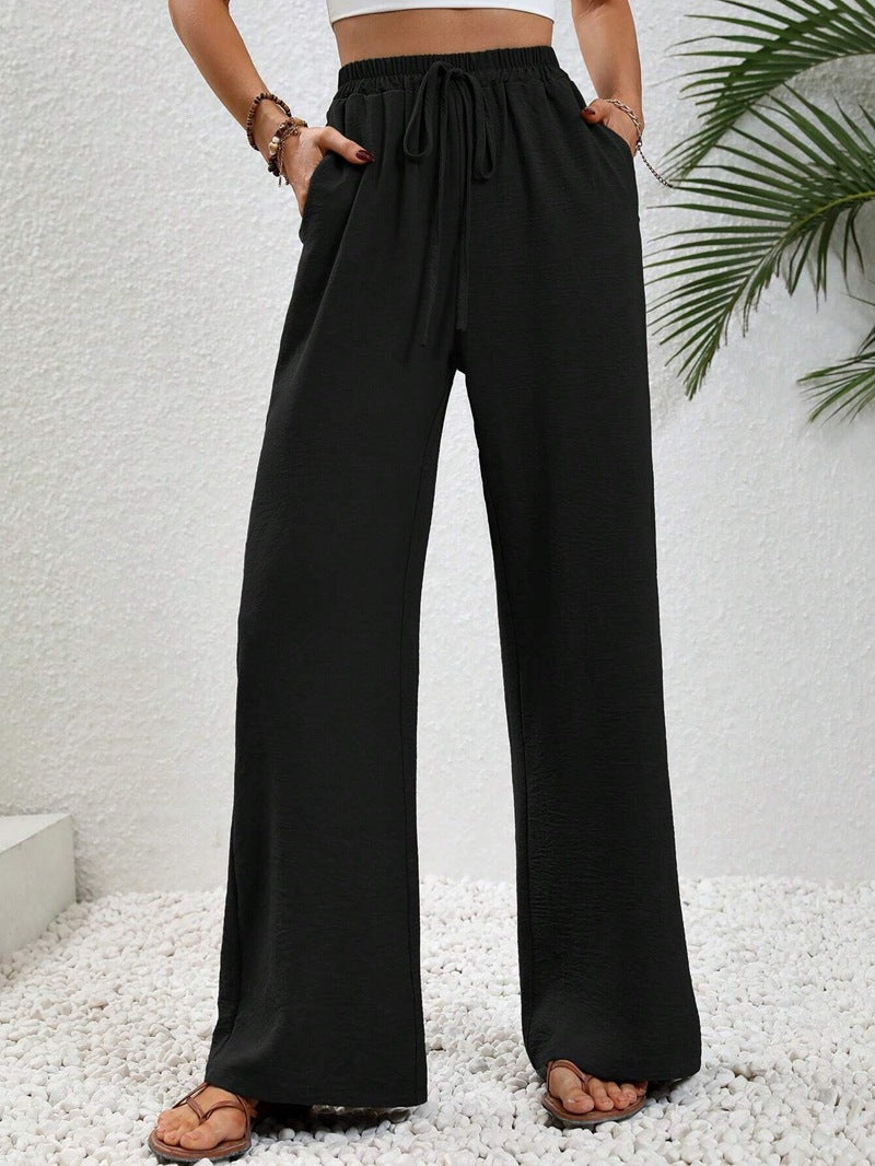 Woman wearing casual wide leg drawstring pants