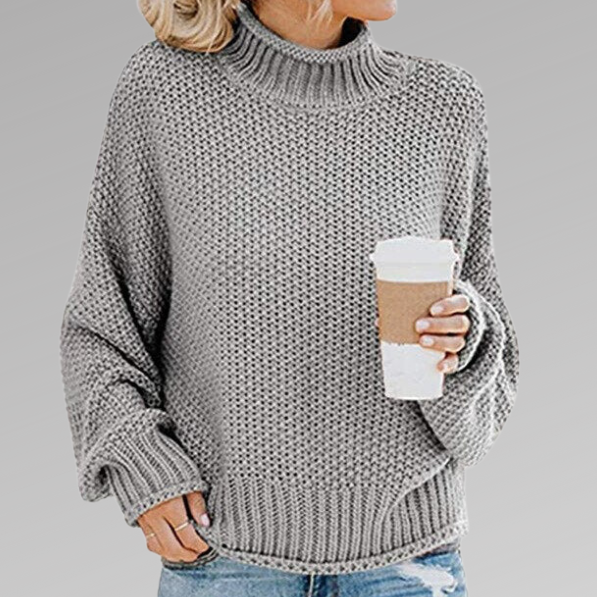 Woman wearing a chunky oversized turtleneck sweater