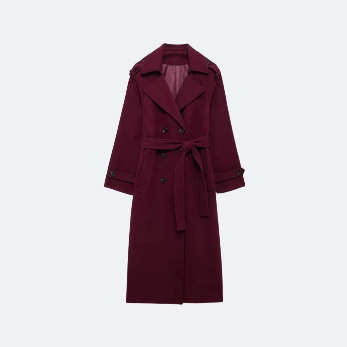 Woman wearing a long double-breasted belted trench coat