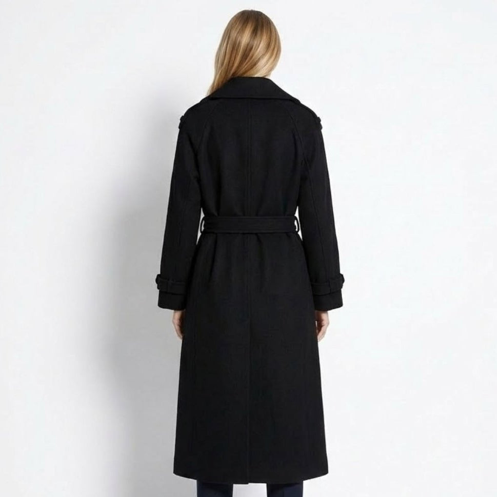 Woman wearing a long double-breasted belted trench coat