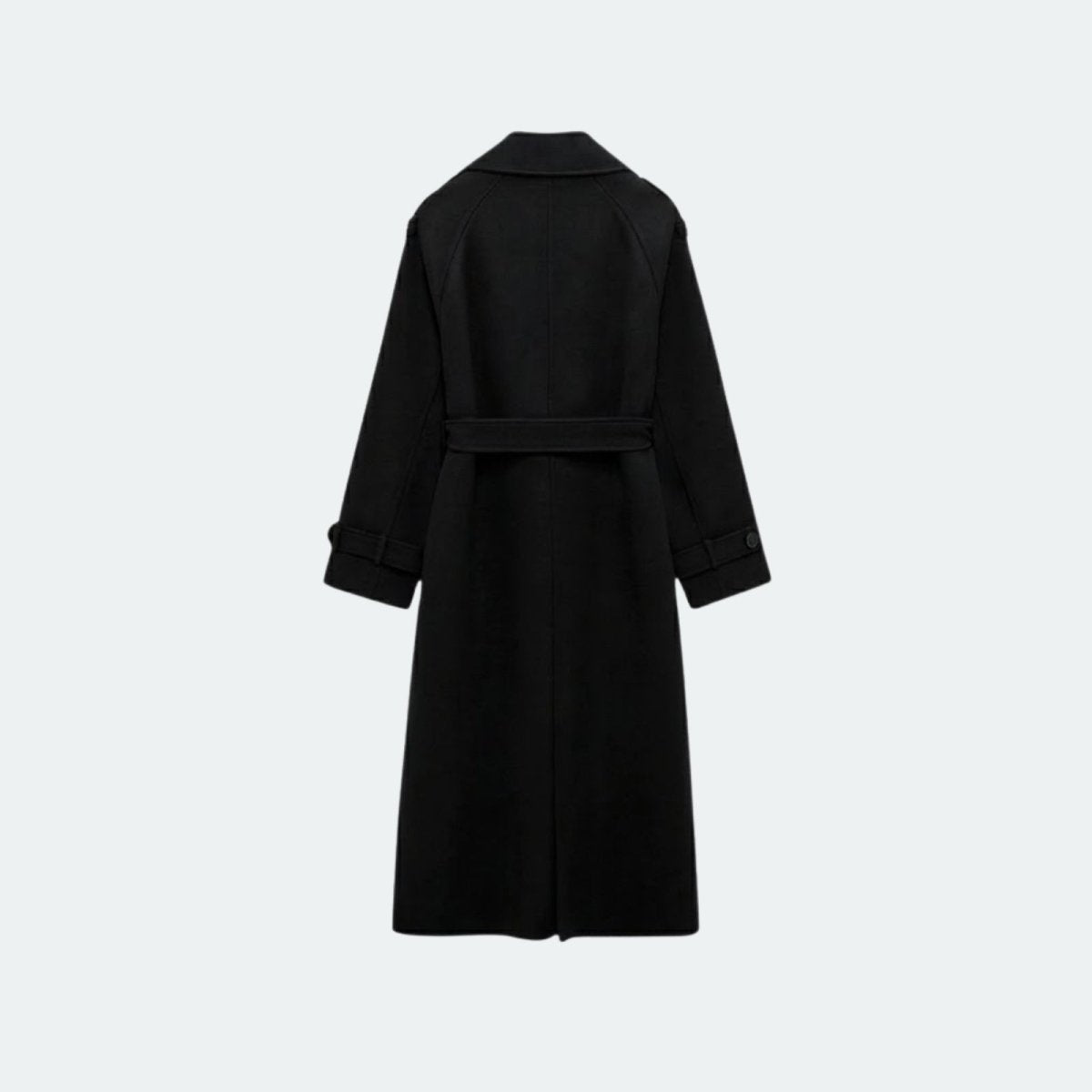 Woman wearing a long double-breasted belted trench coat