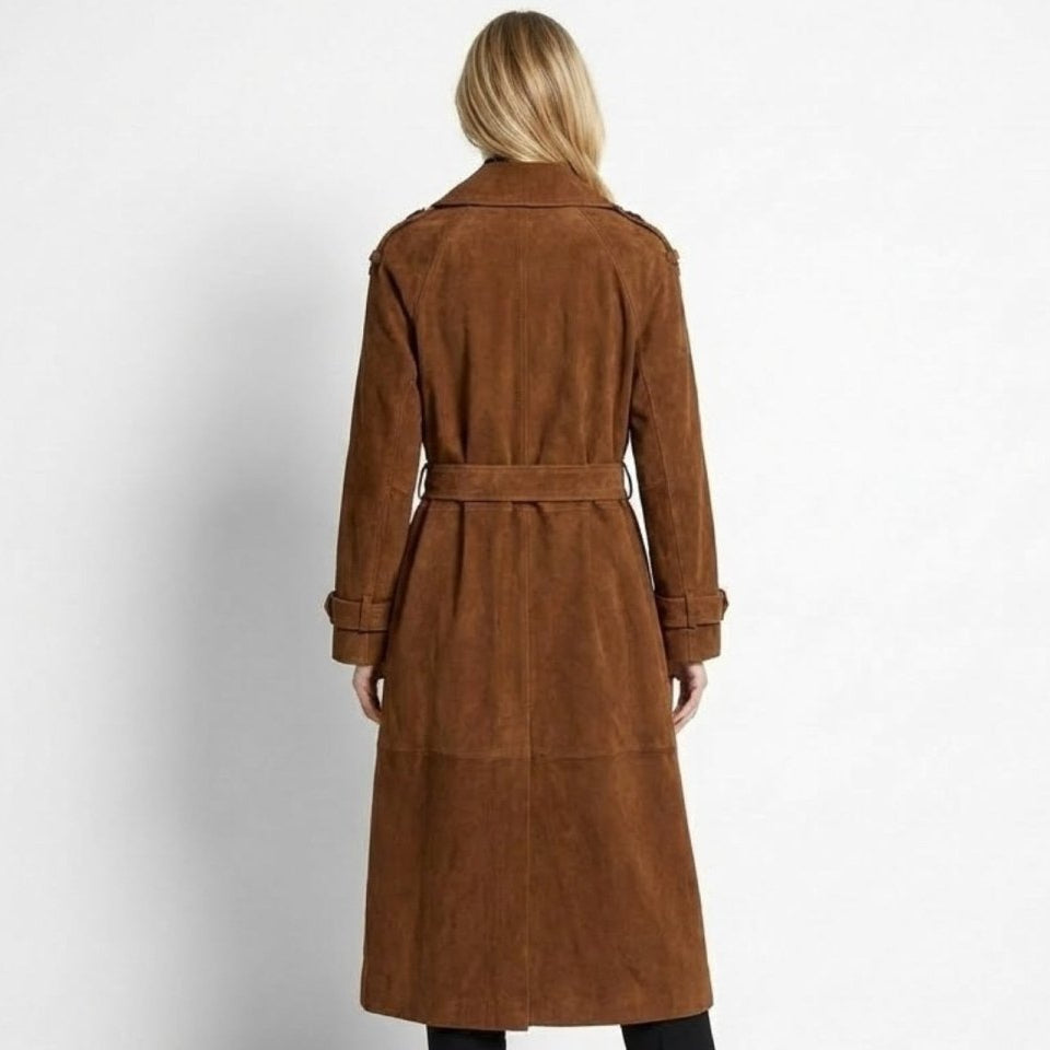 Woman wearing a long double-breasted belted trench coat