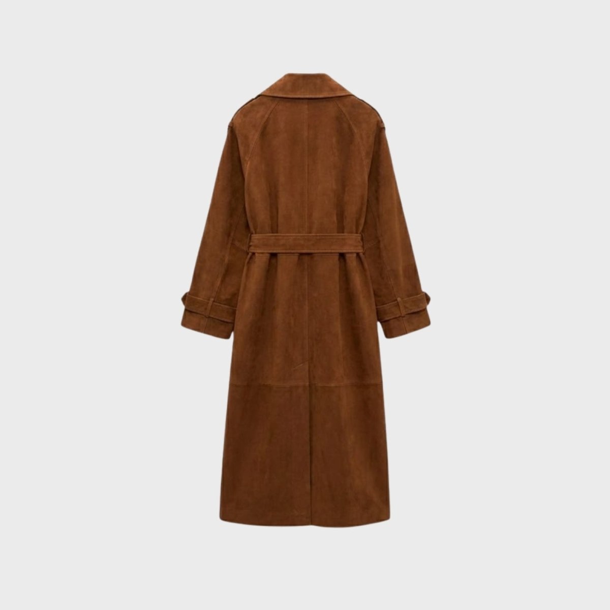 Woman wearing a long double-breasted belted trench coat