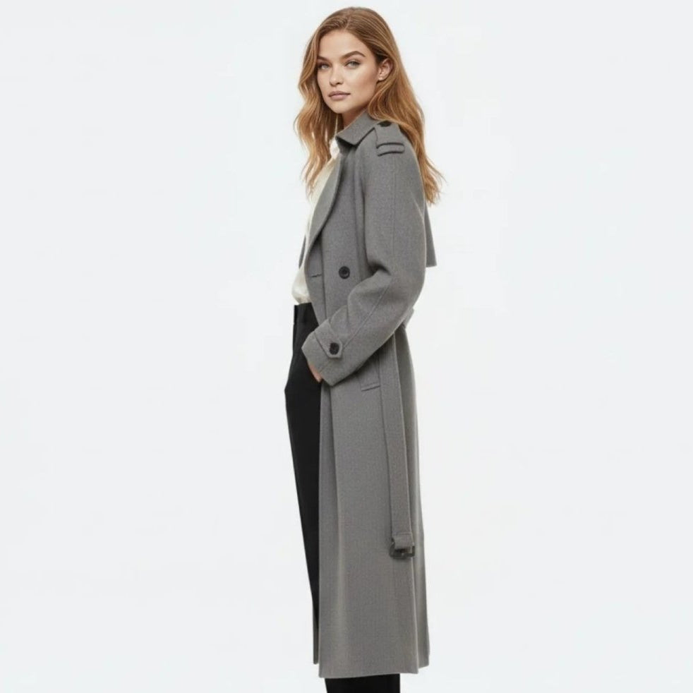 Woman wearing a long double-breasted belted trench coat
