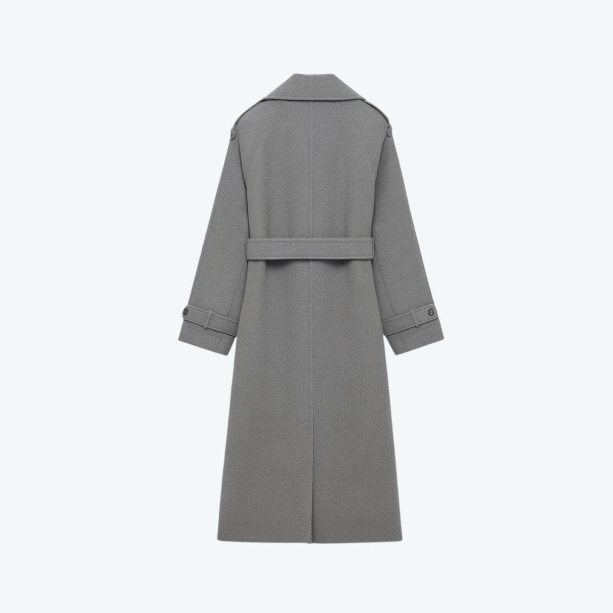 Woman wearing a long double-breasted belted trench coat