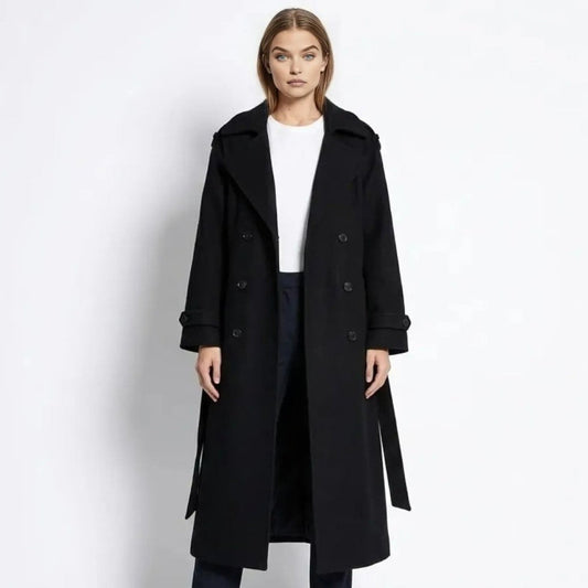 Woman wearing a long double-breasted belted trench coat