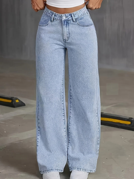 Woman wearing high waisted light wash wide leg jeans with five pocket styling