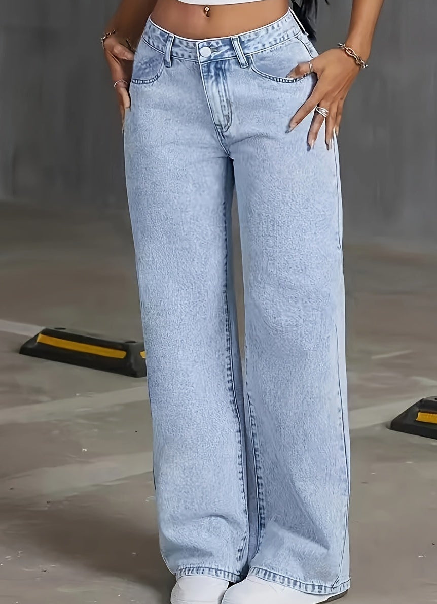 Woman wearing high waisted light wash wide leg jeans with five pocket styling