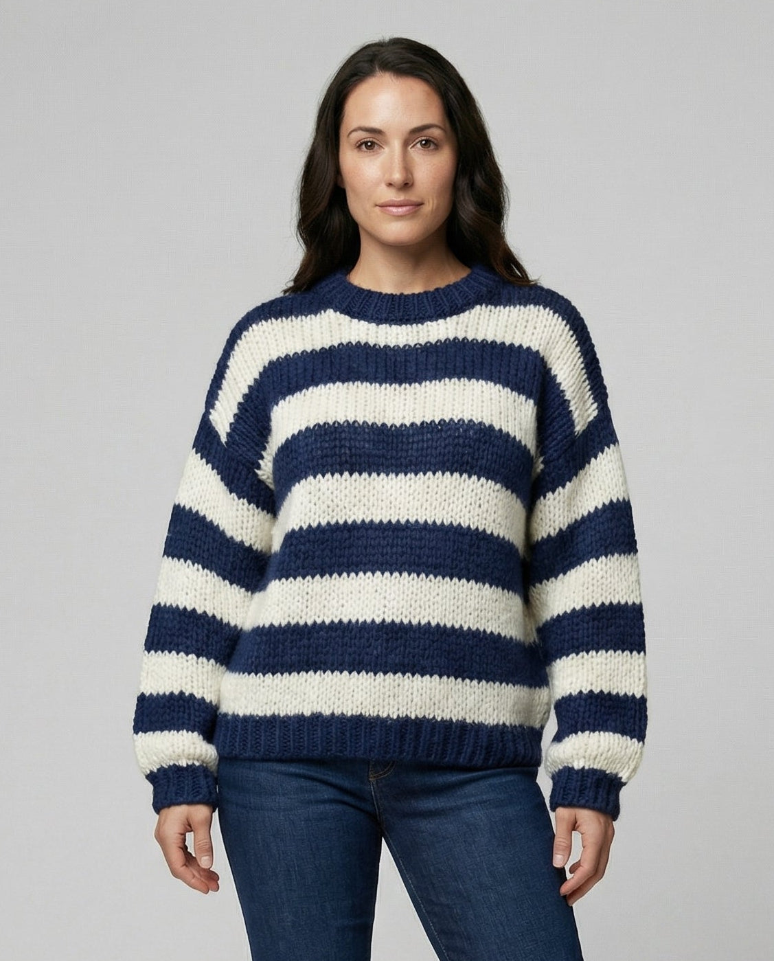Woman wearing a striped oversized knit sweater