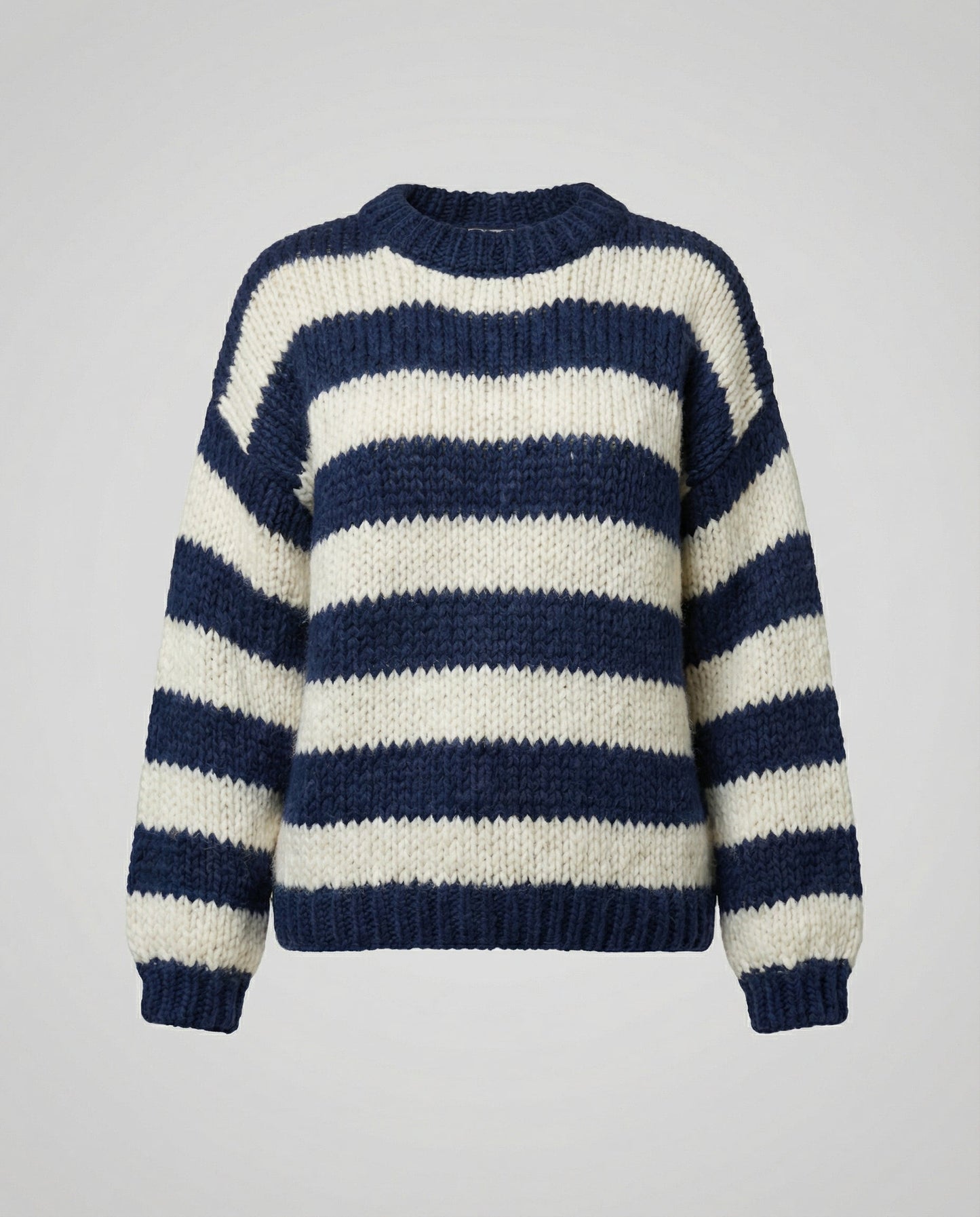 Woman wearing a striped oversized knit sweater