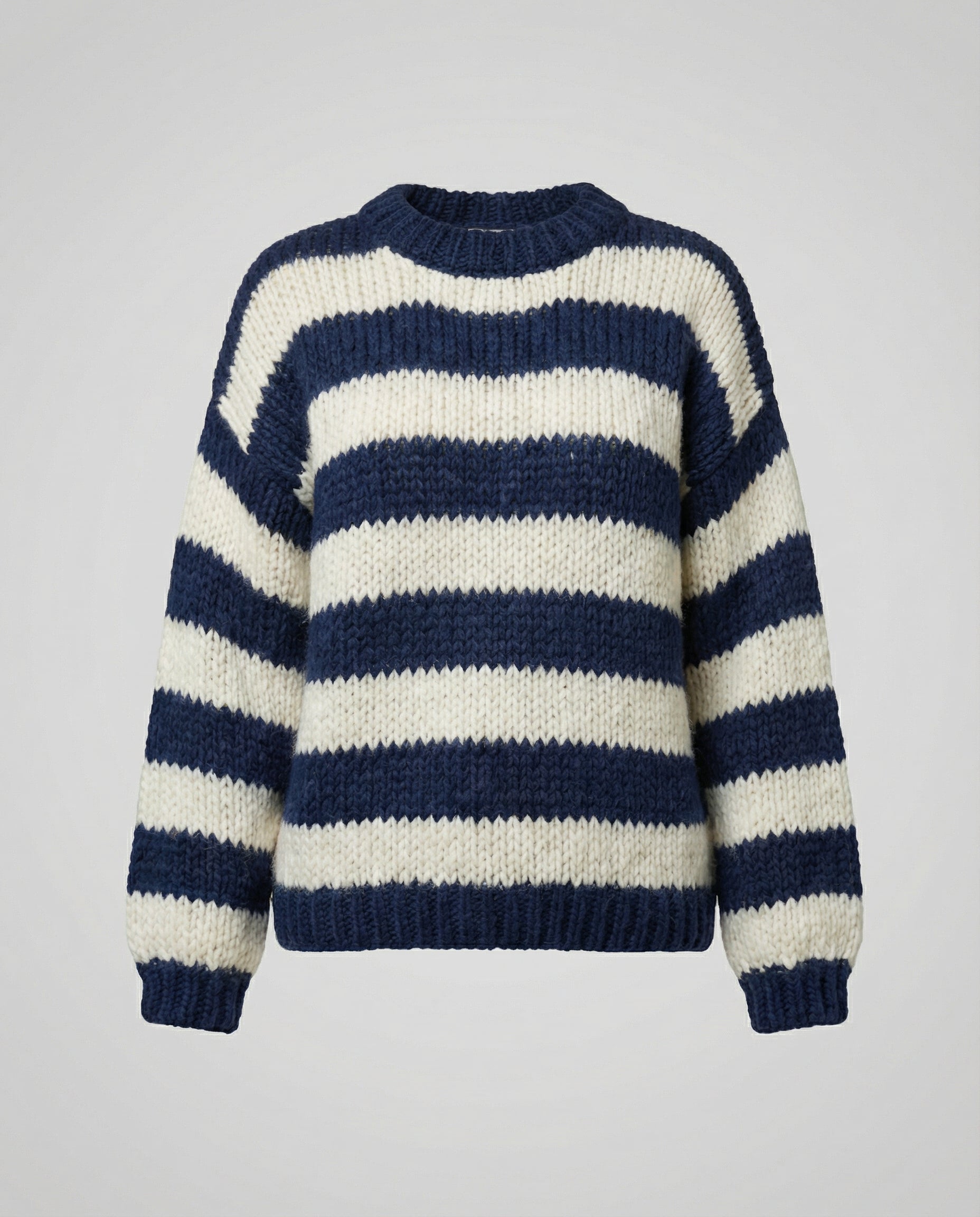 Woman wearing a striped oversized knit sweater