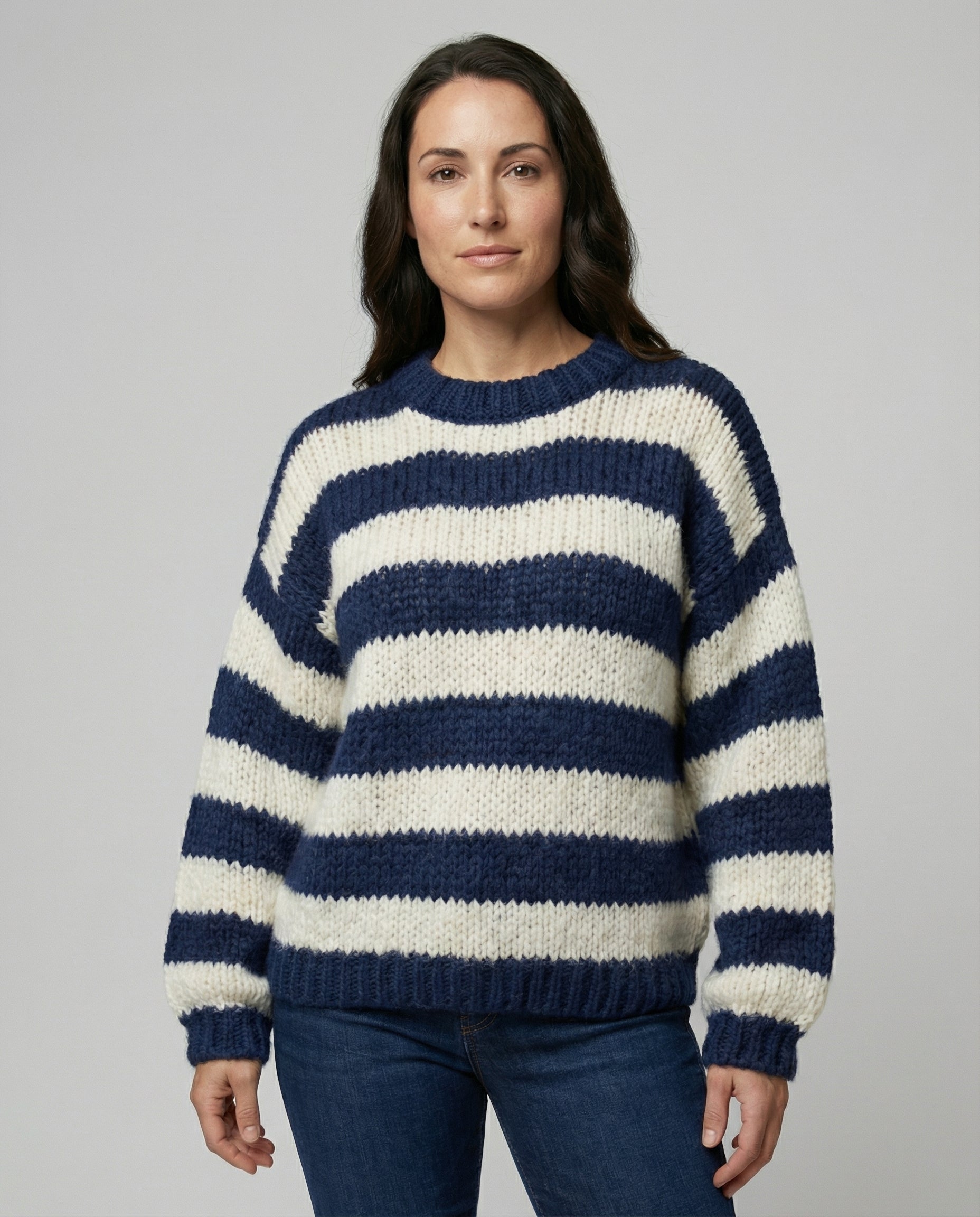 Woman wearing a striped oversized knit sweater