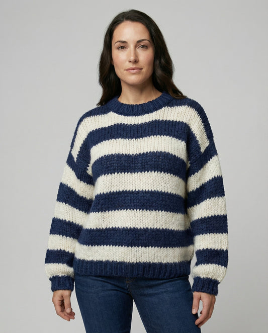 Woman wearing a striped oversized knit sweater
