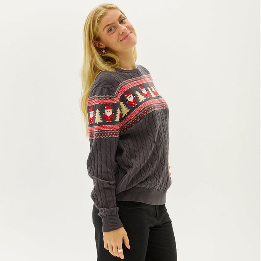 Woman wearing a cozy snowflake knit Christmas sweater