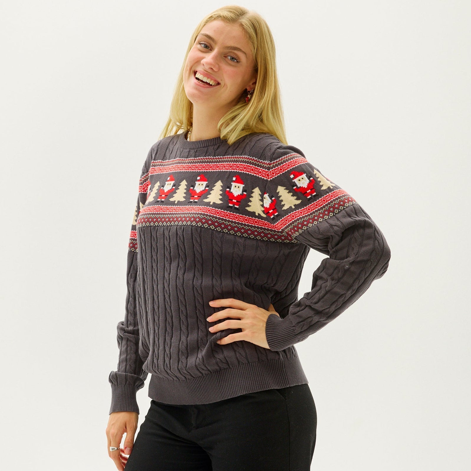 Woman wearing a cozy snowflake knit Christmas sweater
