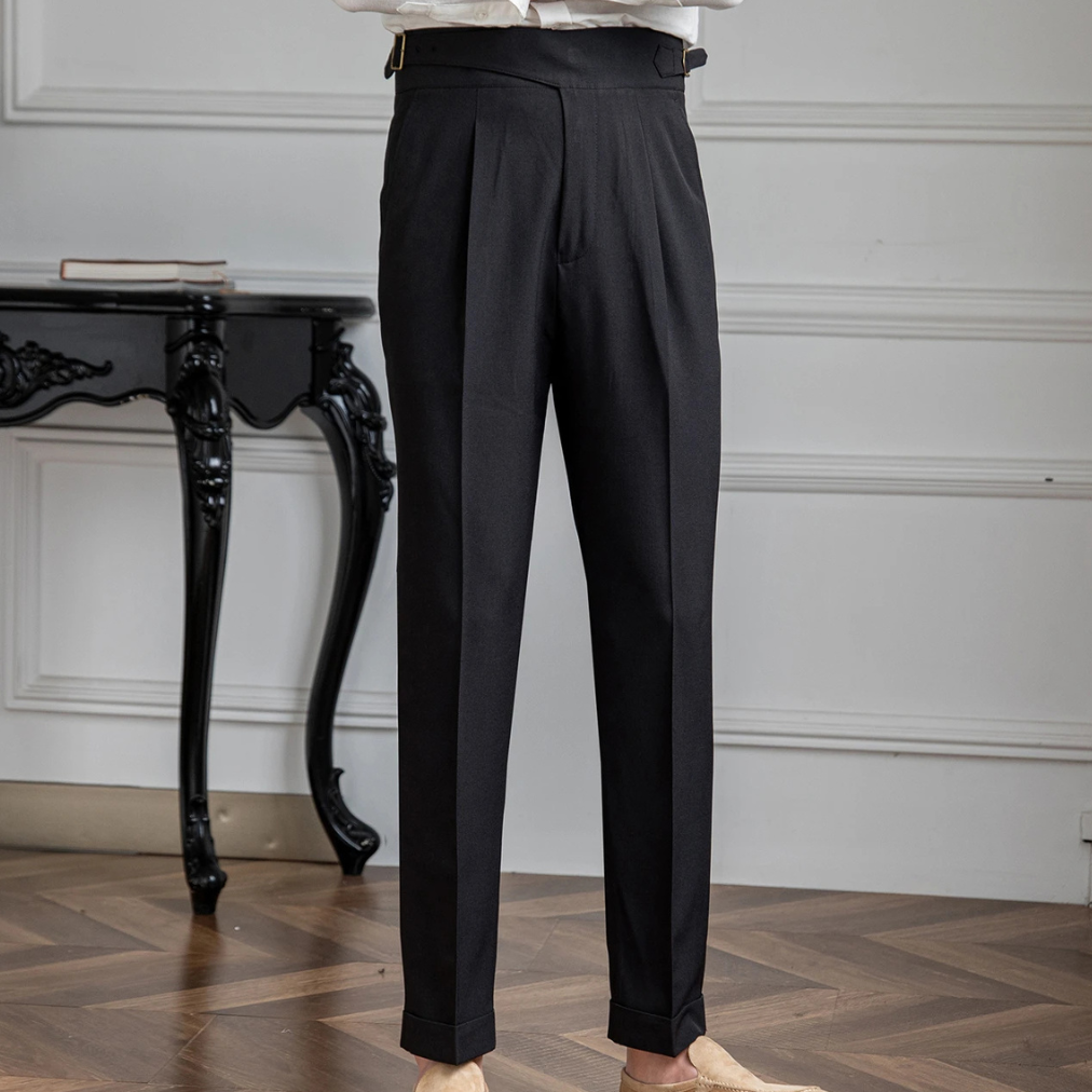 Man wearing tapered pleated dress pants